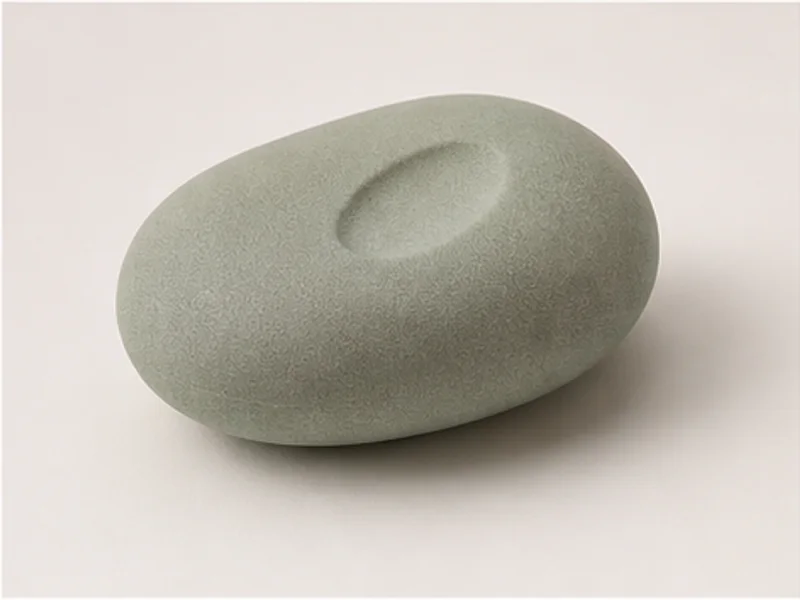 Realistic studio product photo of the pretend product Deep Breath Pebble.