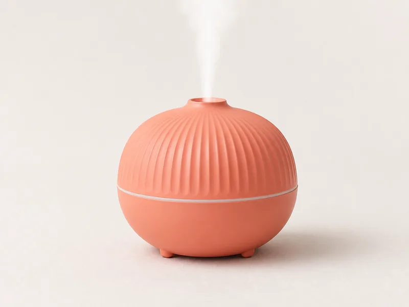 Generated generic product photo of a coral citrus diffuser.